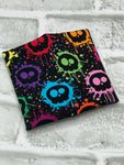 Black splatter skulls yarn cozy